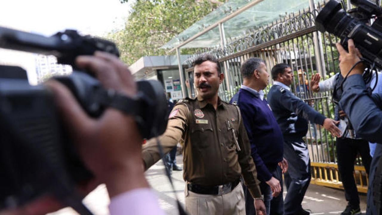 Police officers stand outside the BBC office in New Delhi, where Income Tax officials are conducting a search, February 14, 2023. Credit: Reuters Photo