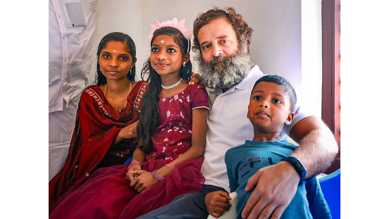 Rahul Gandhi with beneficiaries of Kaithangu project, in Wayanad. Credit: PTI Photo