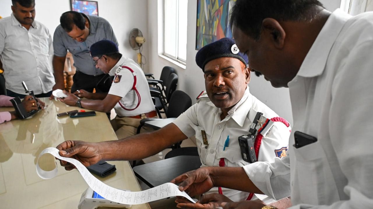 People pay fines at the Traffic Management Centre on Infantry Road in Bengaluru. Credit: DH File Photo