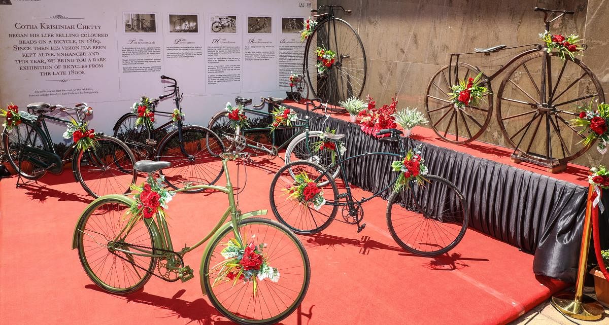 Models like The Boneshaker, Penny Farthing, Hetchins Tandem and Rudge Whitworth Ltd are on display.