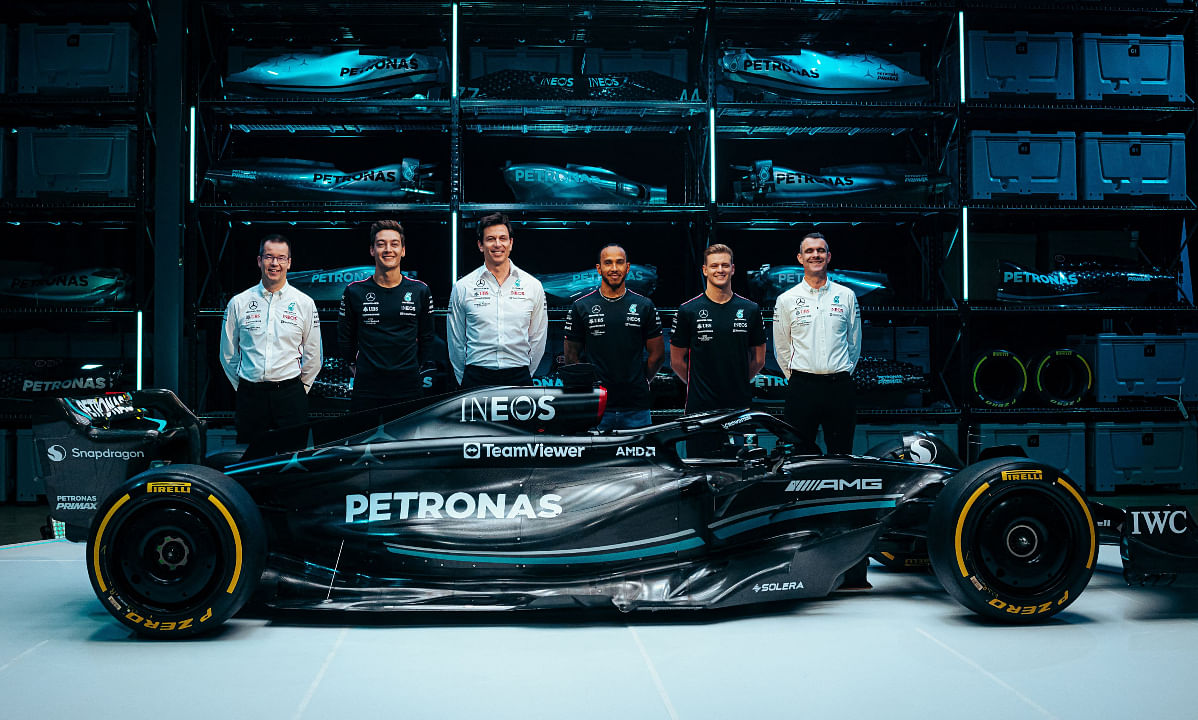 The Mercedes team with the new Mercedes-AMG F1 W14 E Formula One racing car. Credit: AFP Photo/ Mercedes-AMG