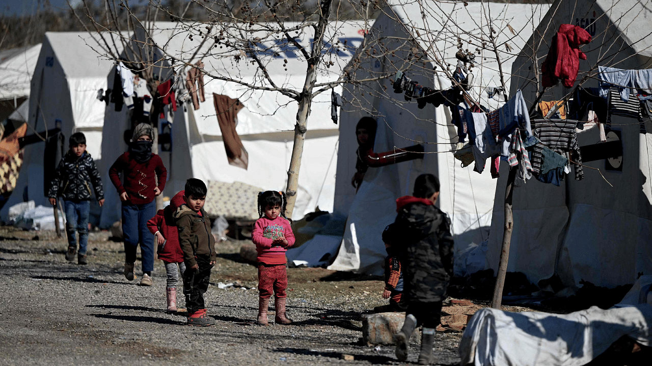 Children walk in a camp for Syrian refugee in Turkey set up by Turkish relief agency AFAD in the Islahiye district of Gaziantep. Credit: AFP Photo