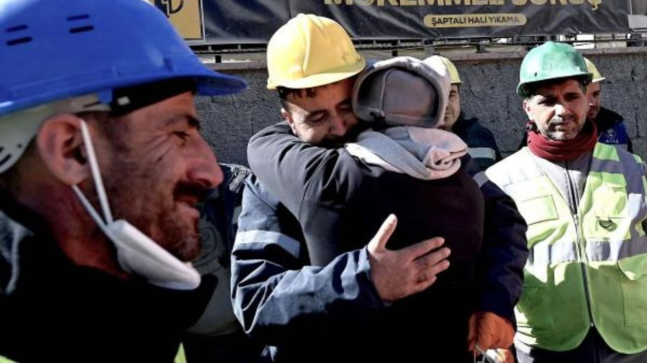 The uncle of Aleyna Olmez (C), reacts after the 17-year-old woman was rescued from a collapsed building, 248 hours after the 7.8-magnitude earthquake in Kahramanmaras, Turkey. Credit: AFP Photo