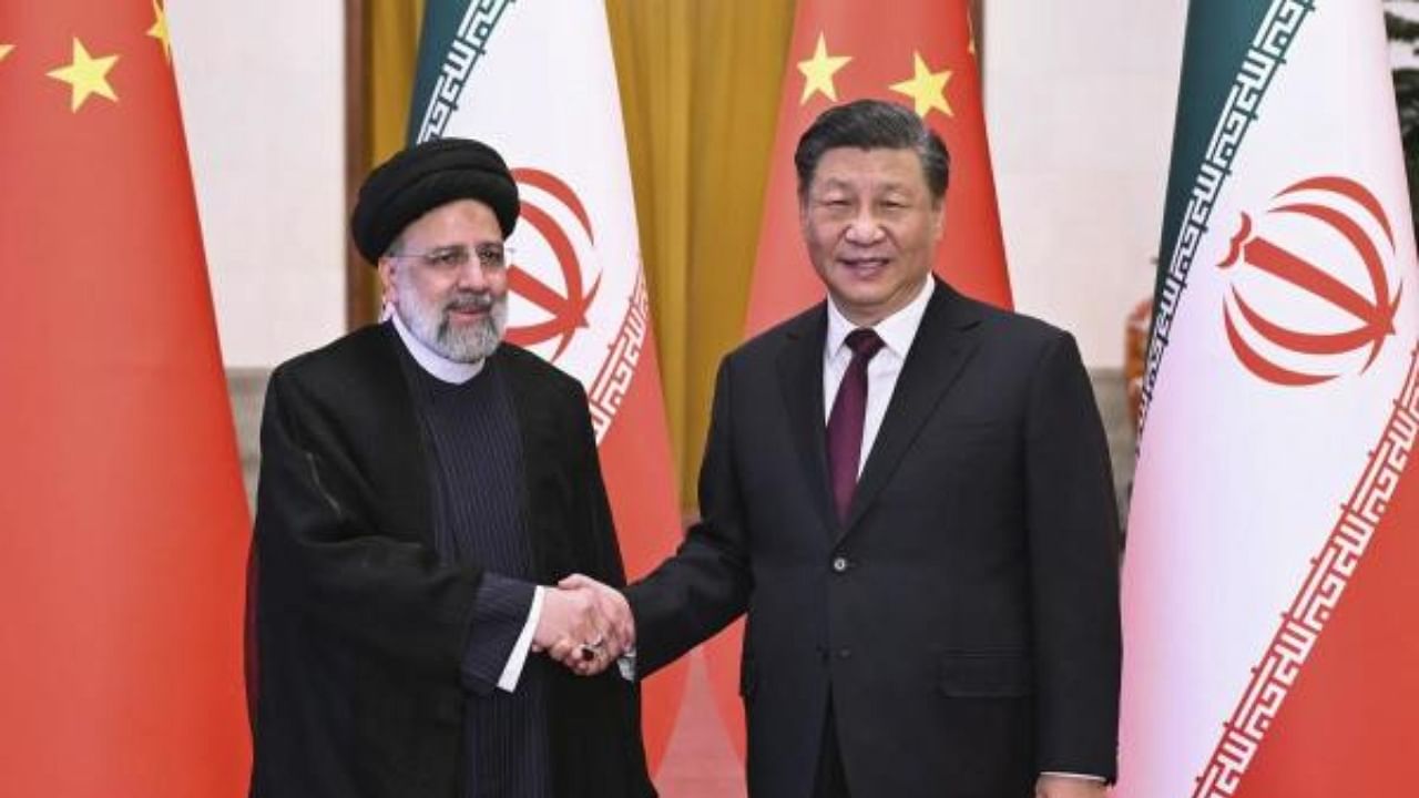 Iranian President Ebrahim Raisi, left, shakes hands with Chinese President Xi Jinping before their meeting at the Great Hall of the People in Beijing. Credit: AP Photo