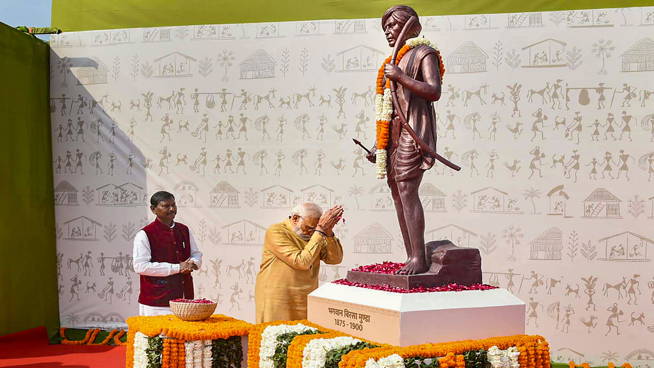 Prime Minister Narendra Modi pays homage to tribal freedom fighter Birsa Munda during the inauguration of 'Aadi Mahotsav'. Credit: PTI Photo