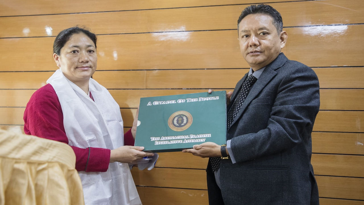 Speaker P D Sona swears in Tsering Lhamu as the Lumla MLA. Credit: Twitter/@PemaKhanduBJP