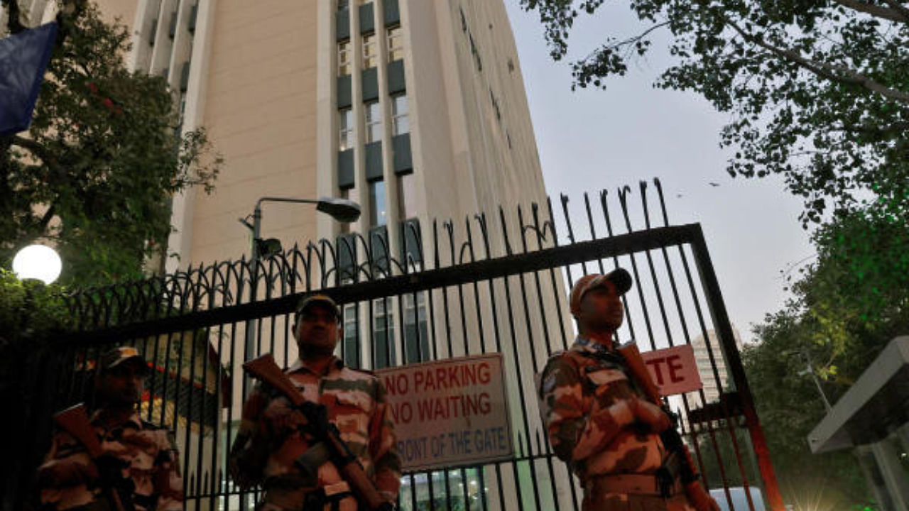 Members of the Indo-Tibetan Border Police (ITBP) stand guard outside a building housing BBC offices, where income tax officials conducted a search, in New Delhi. Credit: Reuters Photo