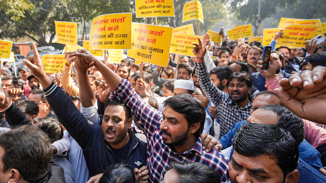 AAP leaders and workers during a protest near the BJP headquarters over the delay in MCD Mayor's election. Credit: PTI Photo