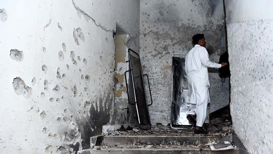 A man is seen inside a police building following an attack in Karachi, Pakistan, on Feb. 17, 2023. Credit: IASN Photo