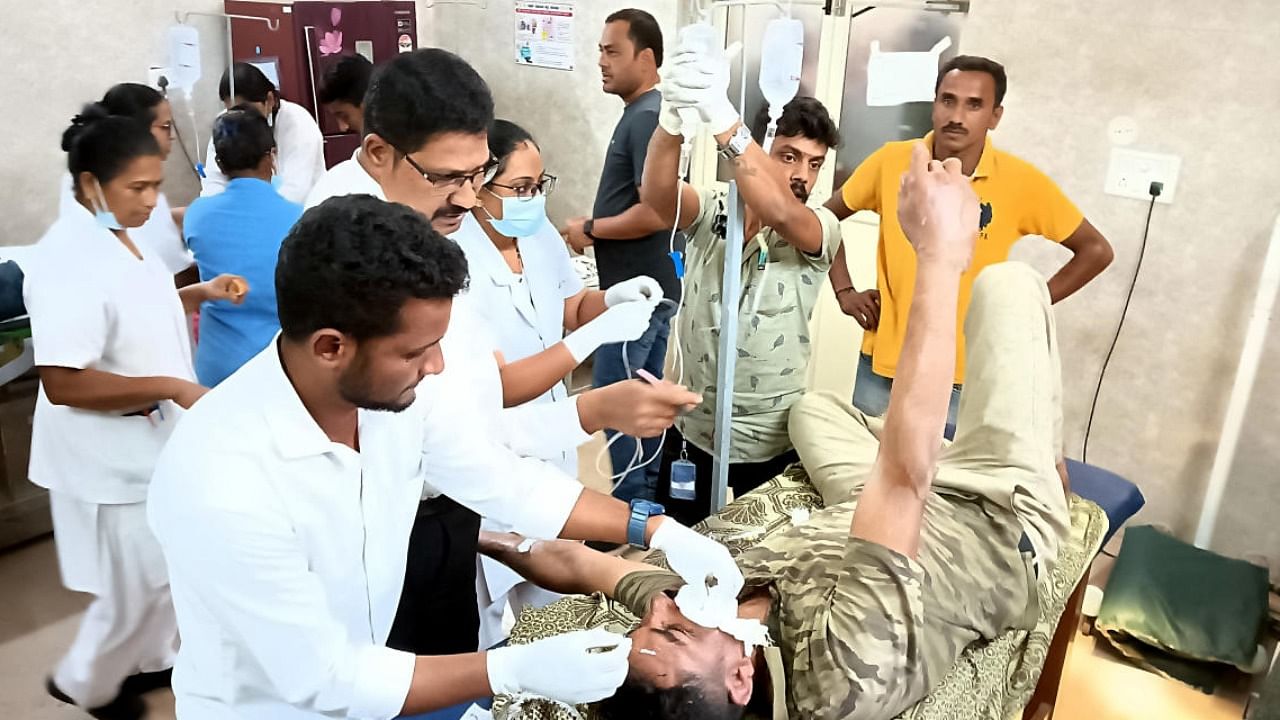 Forest department employees, who suffered burn injuries in a wildfire, are treated at Crawford Hospital in Sakleshpur. DH Photo