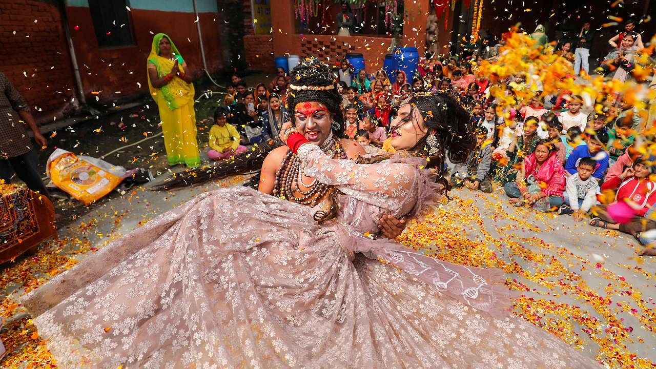 Devotees dressed as Lord Shiva and Goddess Parvati perform during 'Maha Shivratri' celebrations. Credit: PTI Photo