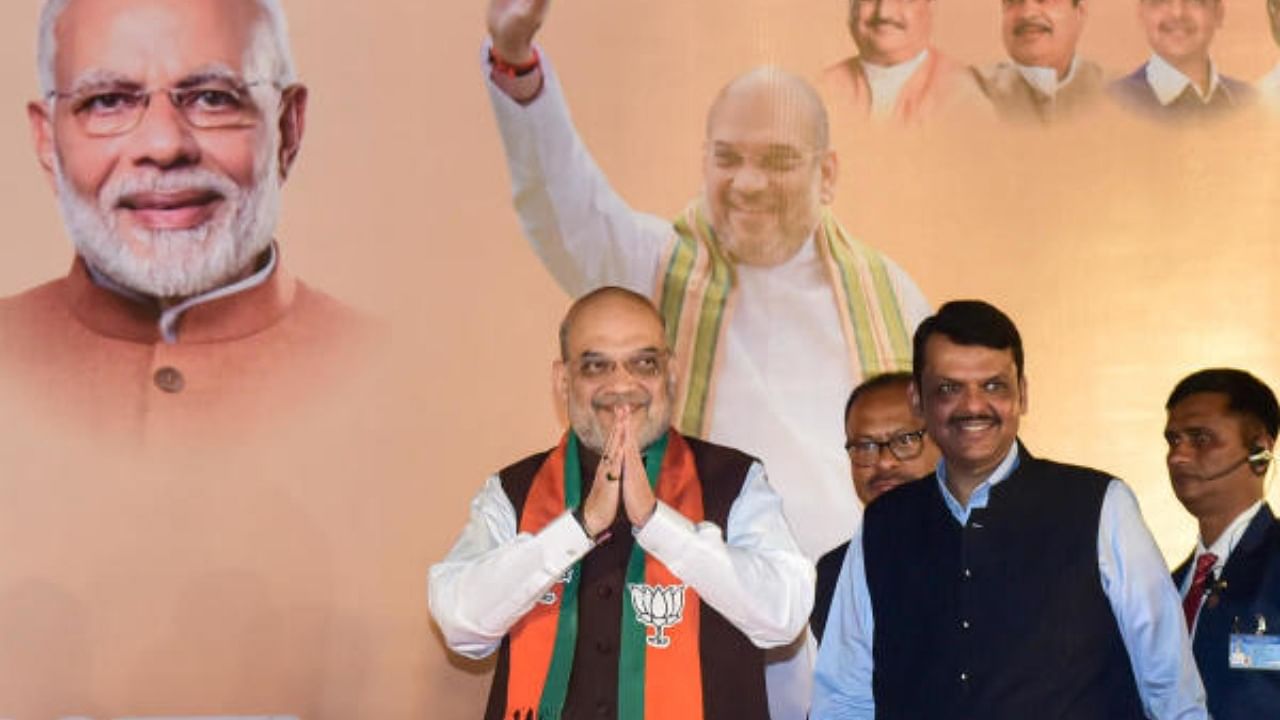 Amit Shah being welcomed by Maharashtra Deputy Chief Minister Devendra Fadnavis, in Nagpur. Credit: PTI Photo