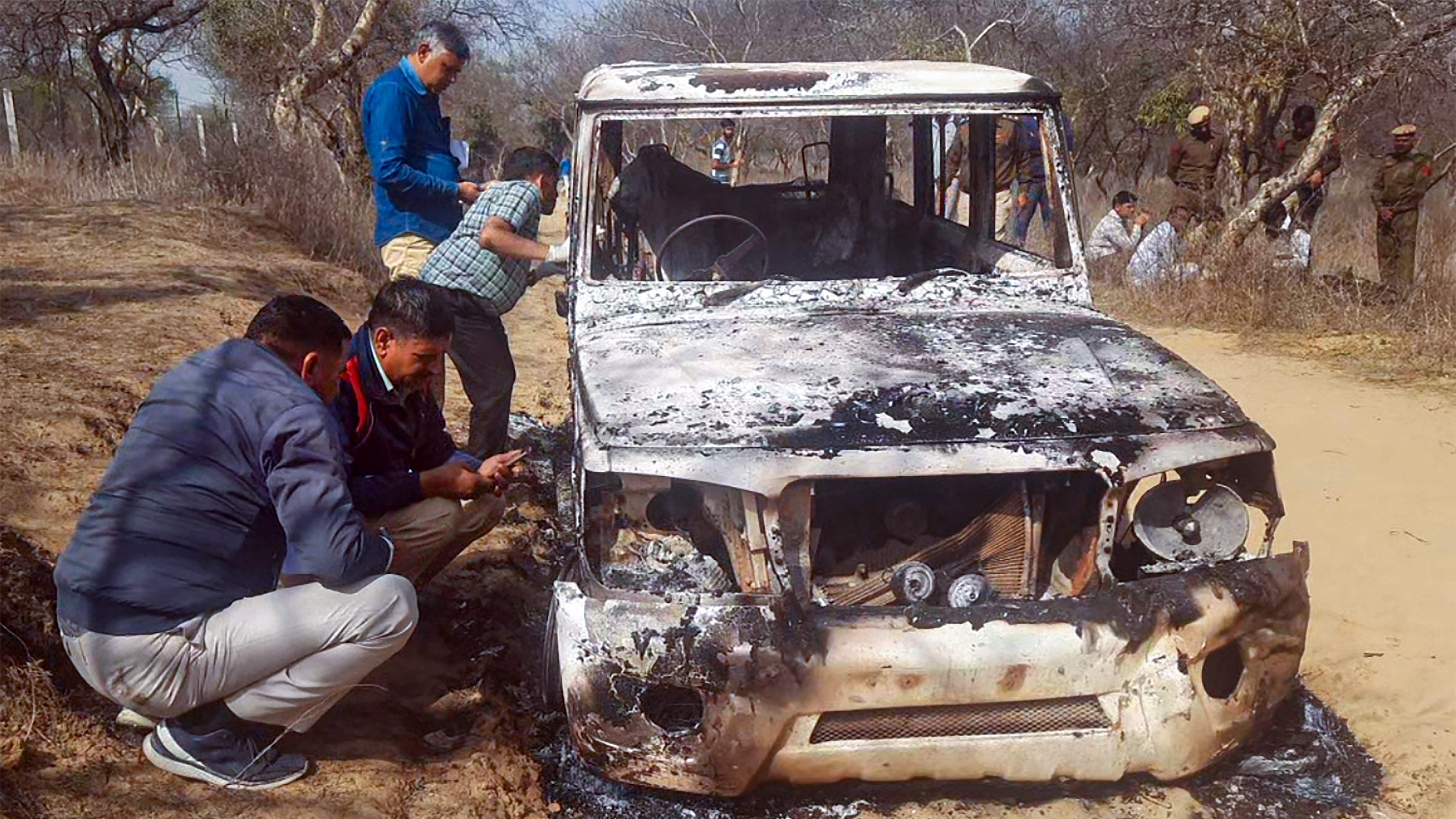 Charred remains of a vehicle where bodies of two Muslim men were found, at Loharu in Bhiwani district, Haryana. Credit: PTI Photo
