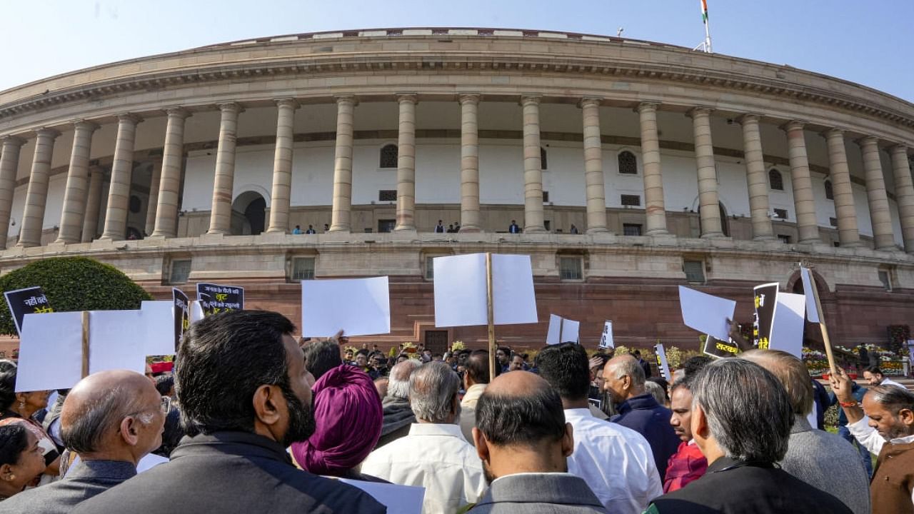 Opposition parties' MPs stage a protest over Adani row in the Parliament complex, in New Delhi. Credit: PTI File photo