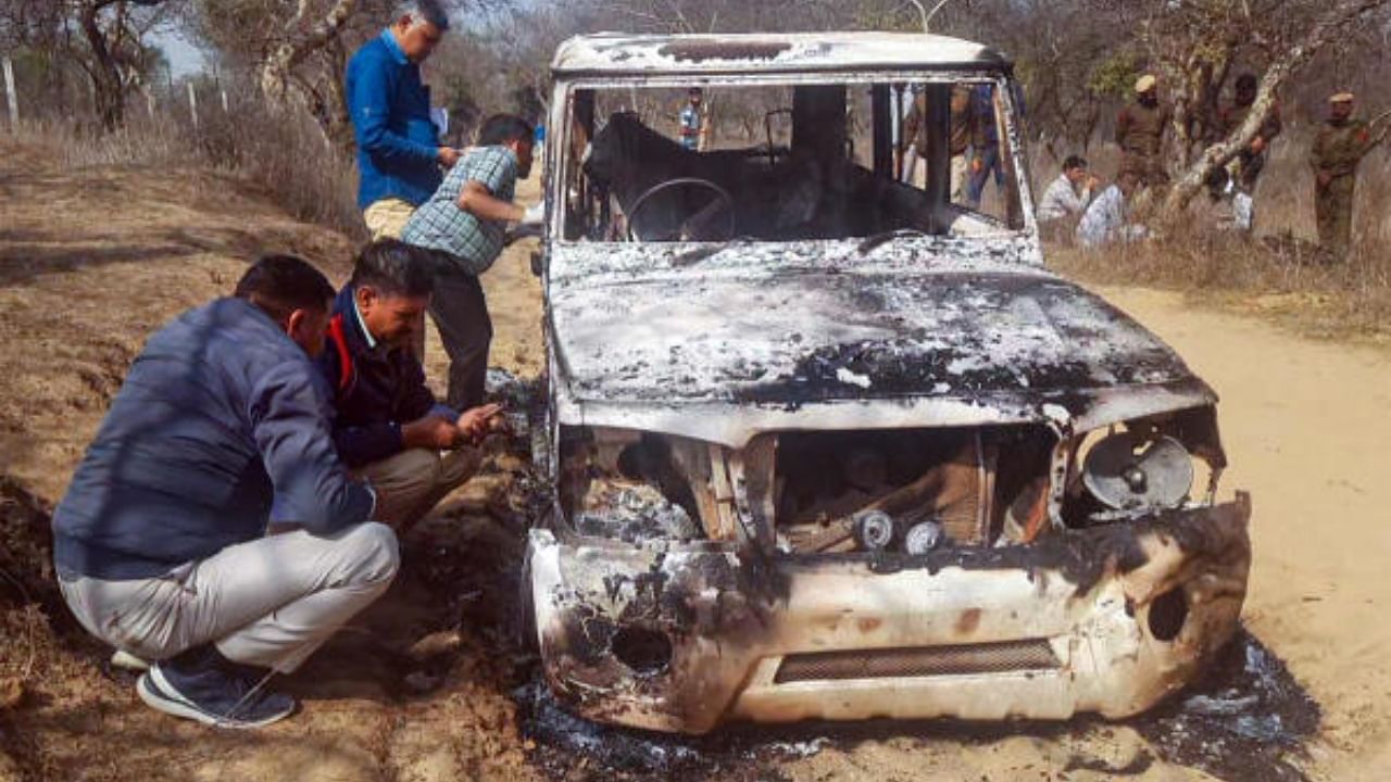 Charred remains of a vehicle where bodies of two Muslim men were found, at Loharu in Bhiwani district, Haryana. Credit: PTI Photo