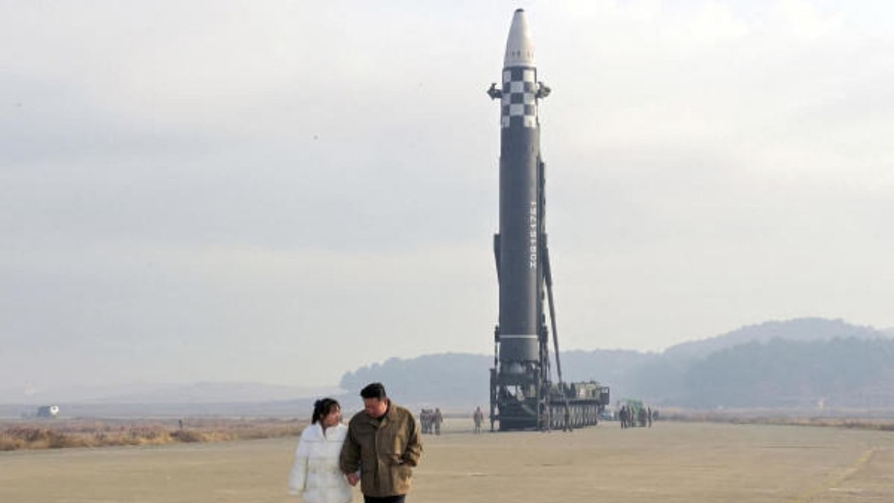 North Korean leader Kim Jong Un, along with his daughter, walks away from an ICBM. Credit: KCNA via Reuters Photo