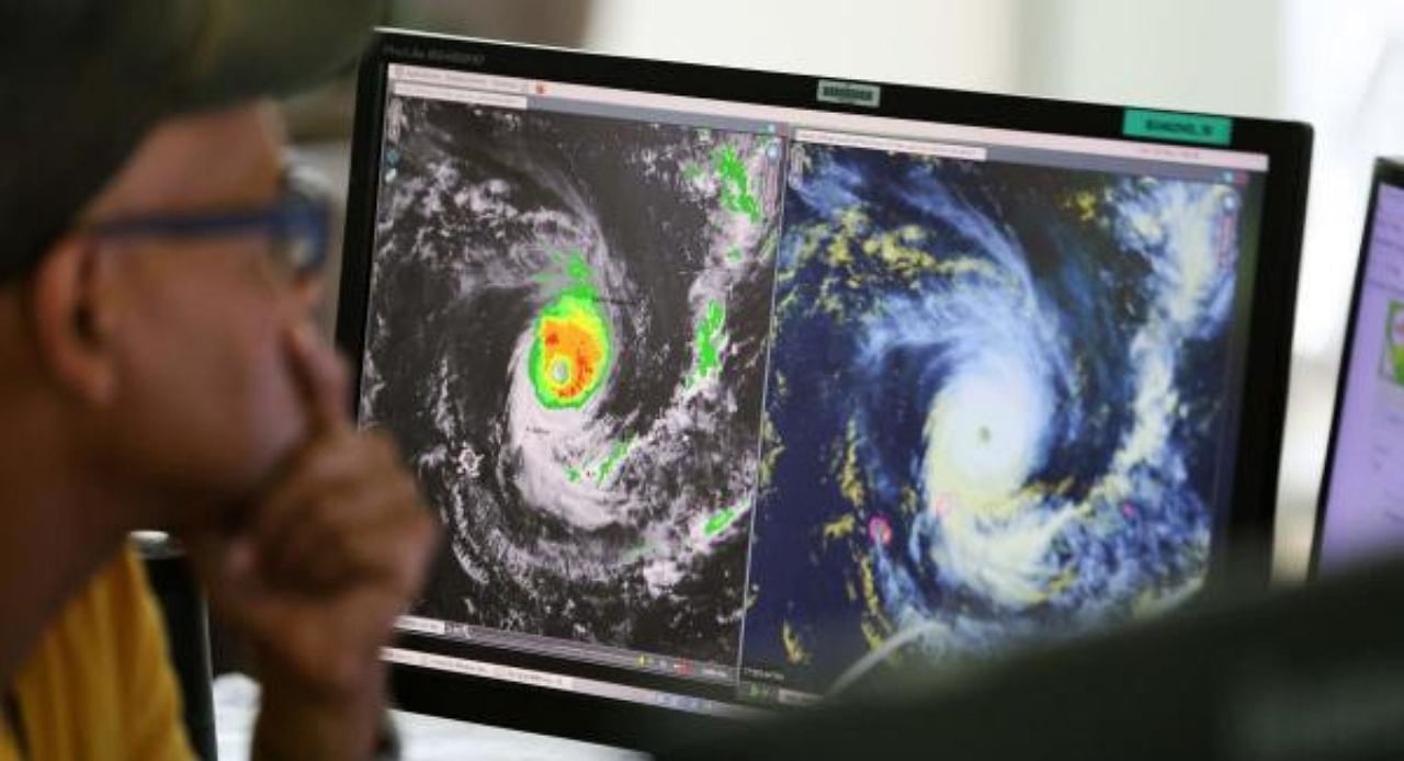 Forecasters watch satelitte control screens as they monitor Cyclone Freddy at Metor France, on the French overseas island of La Reunion on February 20, 2023. Credit: AFP Photo