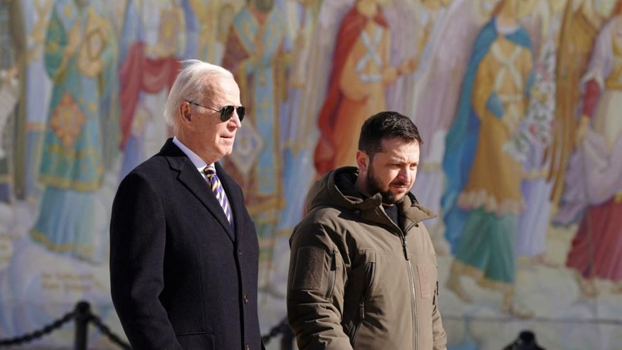 US President Joe Biden (L) walks next to Ukrainian President Volodymyr Zelensky (R) as he arrives for a visit in Kyiv on February 20, 2023. Credit: AFP Photo