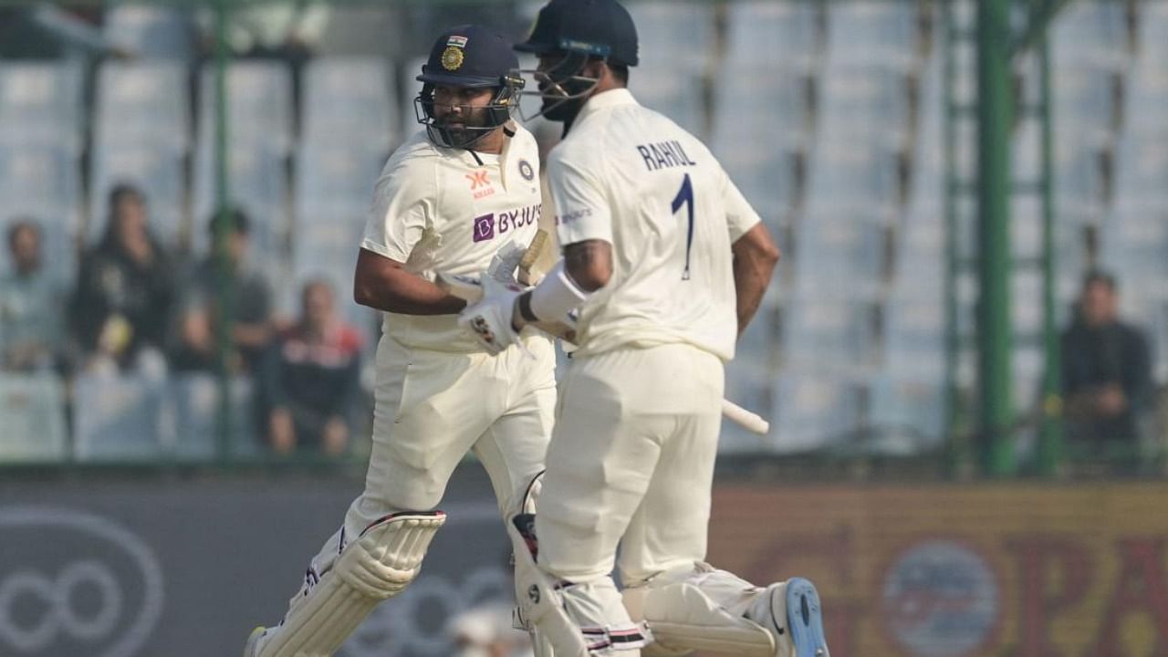 India's captain Rohit Sharma (L) and KL Rahul run between the wickets during the second day of the second Test cricket match between India and Australia. credit: AFP Photo