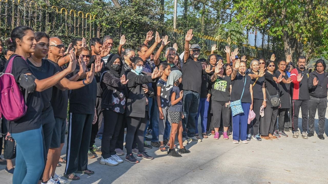 Almost 200 people donned black attire on Sunday morning to protest. Credit: Special Arrangement 