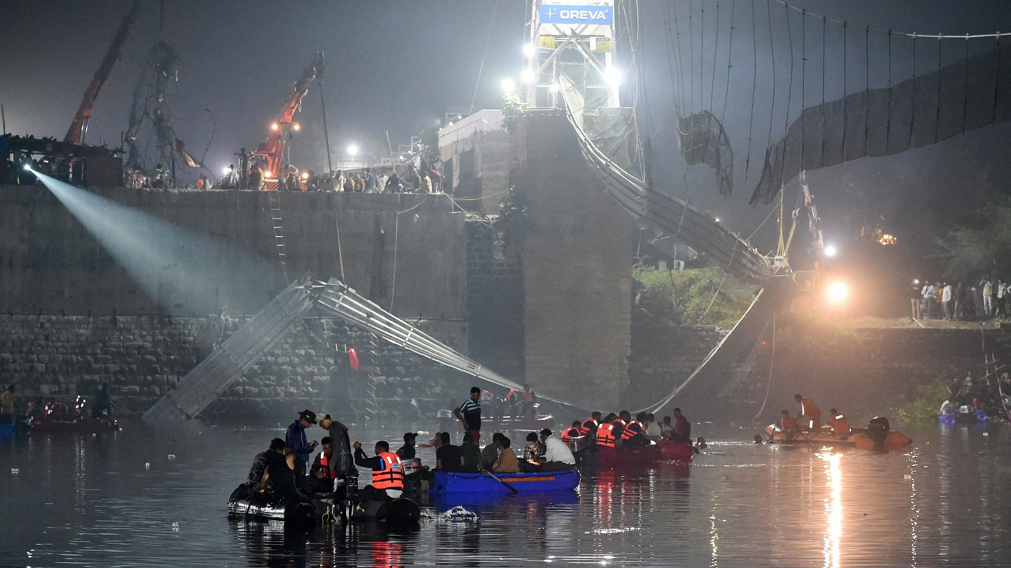 Rescue personnel conduct search operations after the Morbi bridge tragedy on October 31, 2022. Credit: AFP Photo