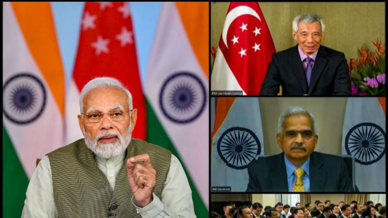 Prime Minister Narendra Modi and Singapore Prime Minister Lee Hsien Loong witness launch of the launch of UPI-PayNow linkage via video conferencing. Credit: PTI Photo