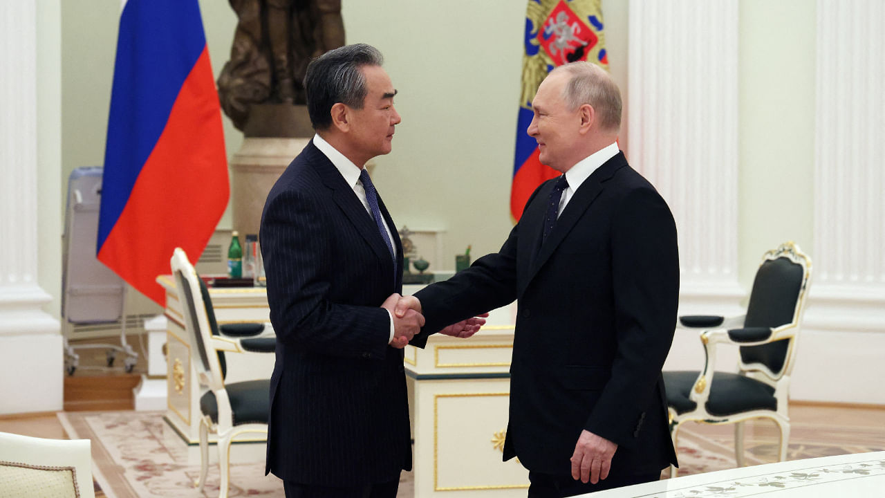 Russia's President Vladimir Putin meets with China's top diplomat Wang Yi in Moscow. Credit: Reuters Photo
