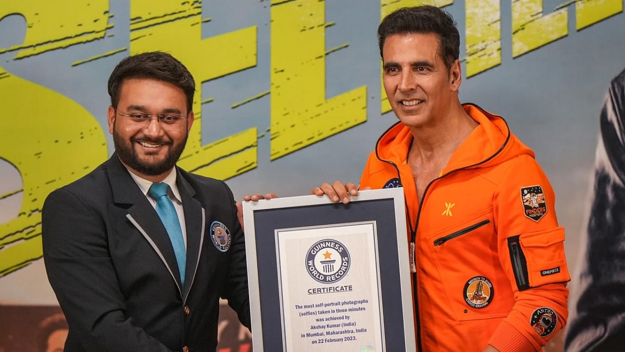 Bollywood actor Akshay Kumar receives the Guinness World Record for ‘most self-portrait photographs’ aka selfies taken in three minutes, during the promotion of his film 'Selfiee' in Mumbai. Credit: PTI Photo