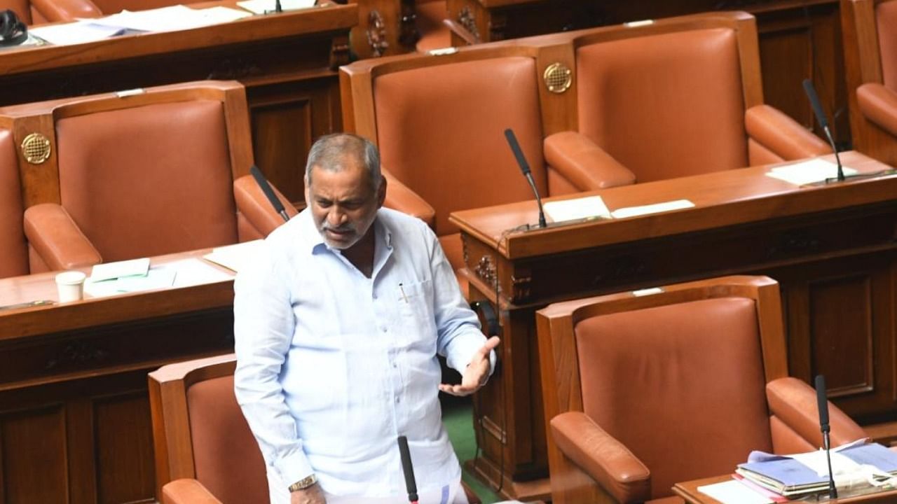 Law Minister J C Madhuswamy speaks in the Legislative Assembly on Tuesday. Credit: DH Photo