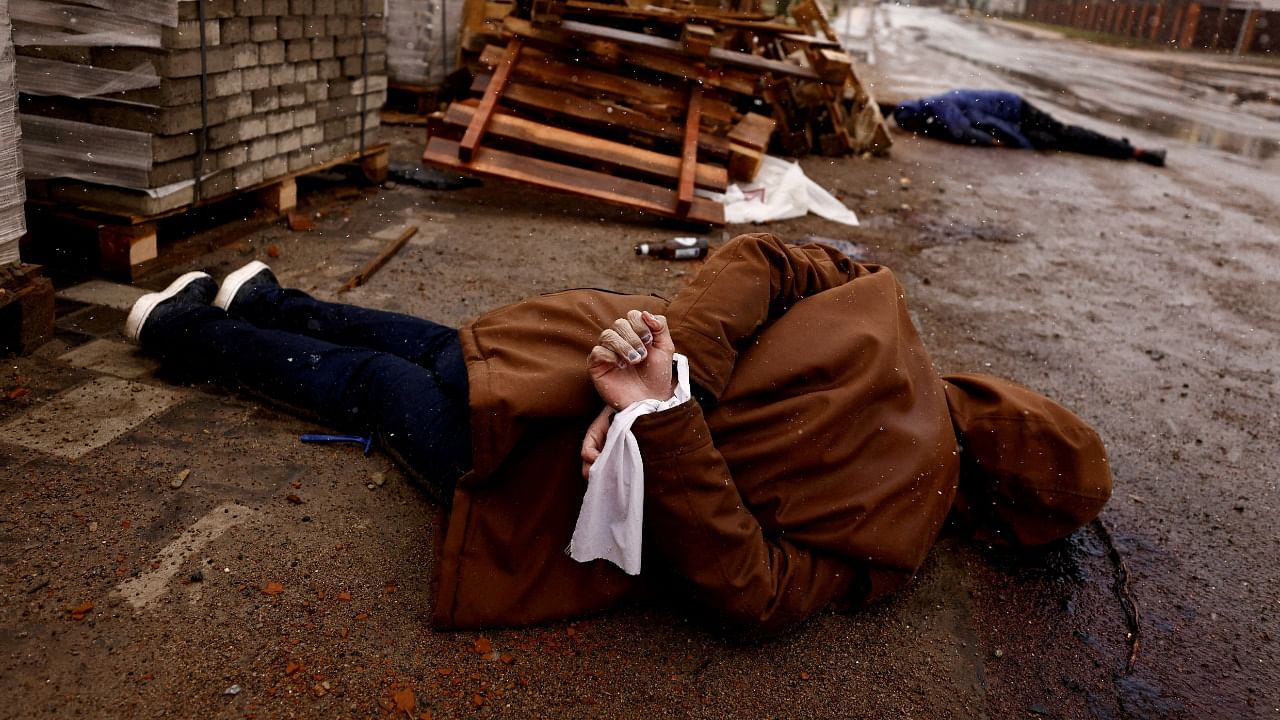 A body with hands bound lies on the street in Bucha, Ukraine. Credit: Reuters/Zohra Bensemra/File Photo