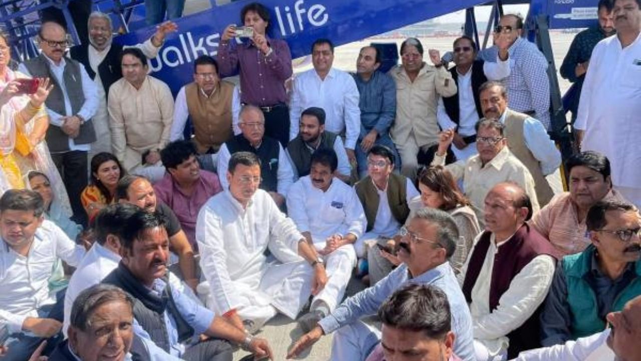 Congress leaders stage a protest dharna at the IGI Airport after the party leader Pawan Khera was allegedly deboarded from the plane owing to an FIR against him. Credit: IANS Photo