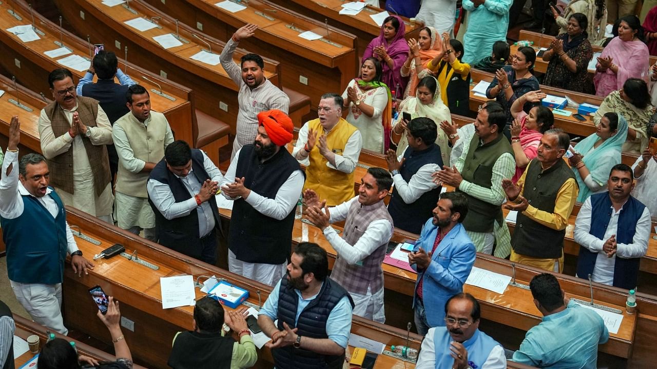 BJP Councillors chant 'Hanuman Chalisa' and raise slogans of 'Jai Sri Ram' over delay in the election of members to the Standing Committee of MCD, at Civic Centre in New Delhi, Wednesday, Feb. 22, 2023. Credit: PTI Photo