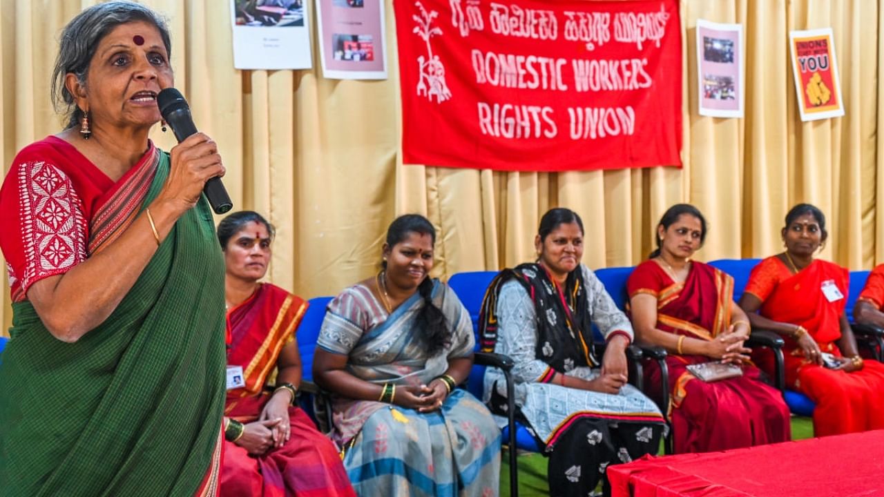 Geeta Menon, Co ordinator Stree Jagriti Samiti speaking at Domestic workers Annul meeting by The Domestic Workers Rights Union at BES College, Jayanagar in Bengaluru on Wednesday, 22nd February 2023. Credit: DH Photo