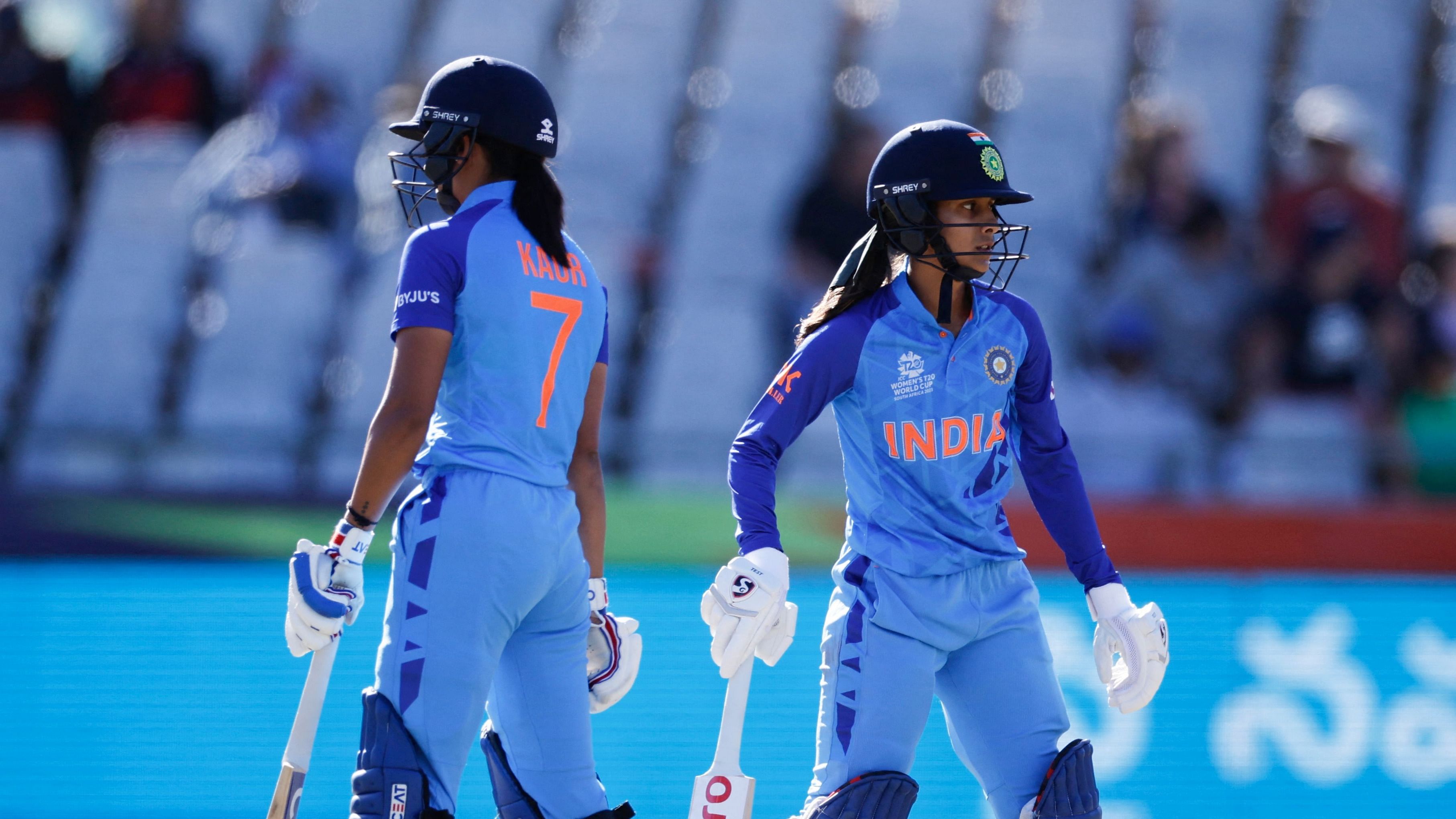 India's Harmanpreet Kaur (L) and India's Jemimah Rodrigues (R) stand on the pitch between overs during the semi-final T20 women's World Cup cricket match between Australia and India at Newlands Stadium in Cape Town on February 23, 2023. Credit: AFP Photo