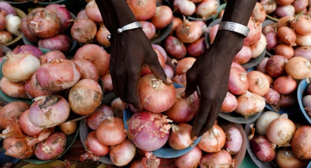 A vendor arranges onions for sale at Mile 12 International Market in Lagos, Nigeria May 13, 2022. Credit: Reuters File Photo