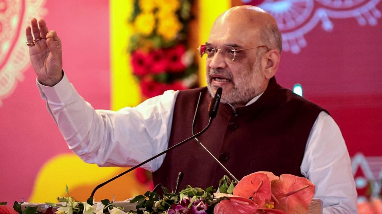 Union Home Minister Amit Shah addresses during the 'Kol Mahakumbh' on the occasion of Shabri Mata Jayanti, in Satna district. Credit: PTI Photo