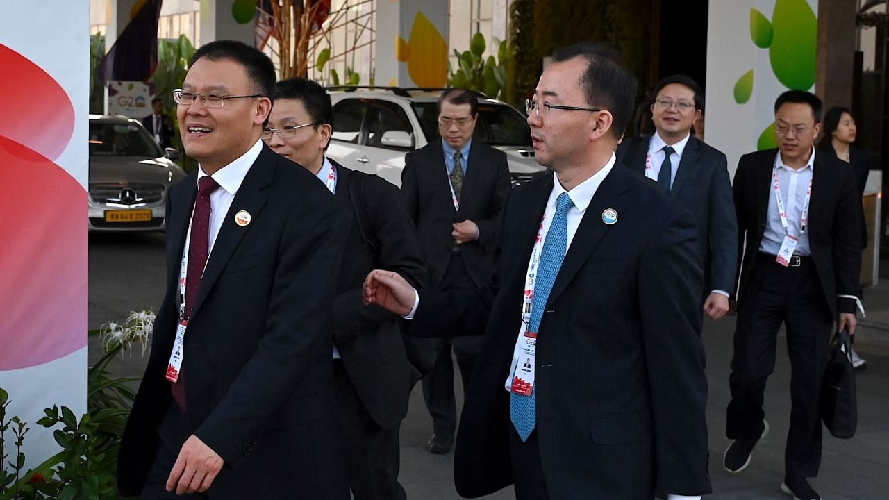 Vice Finance Minister of China, Dongwei Wang (L) and members of his delegation come out of the G20 Finance meeting held under India’s G20 Presidency in Bengaluru. Credit: AFP Photo