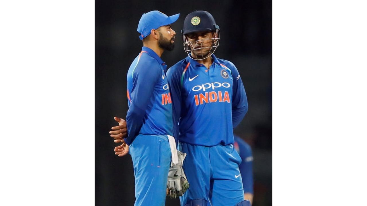 Former Team India skippers Mahendra Singh Dhoni and Virat Kohli. Credit: Reuters File Photo