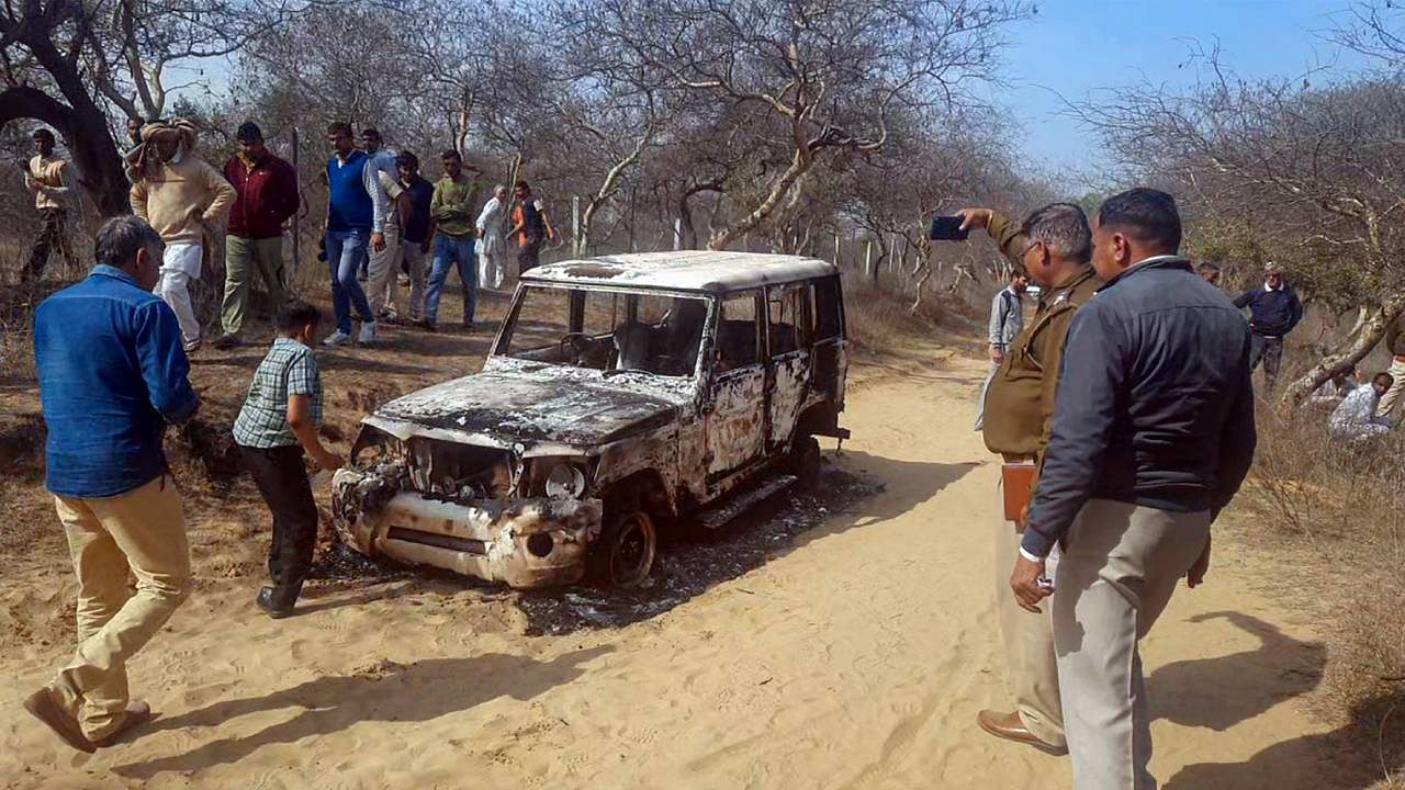 Charred remains of a vehicle where bodies of two Muslim men were found. Credit: PTI Photo