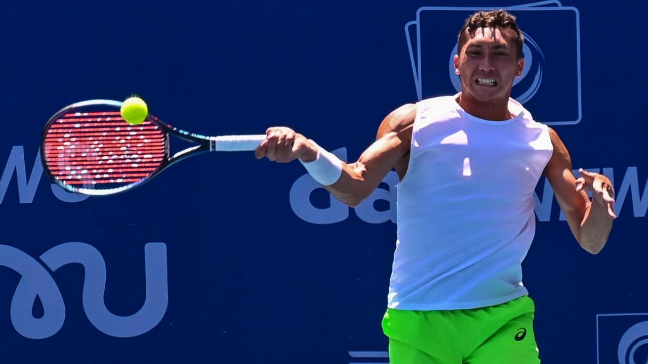 James McCabe returns during his win over Harold Mayot during their clash in the Bengaluru Open. Credit: DH Photo