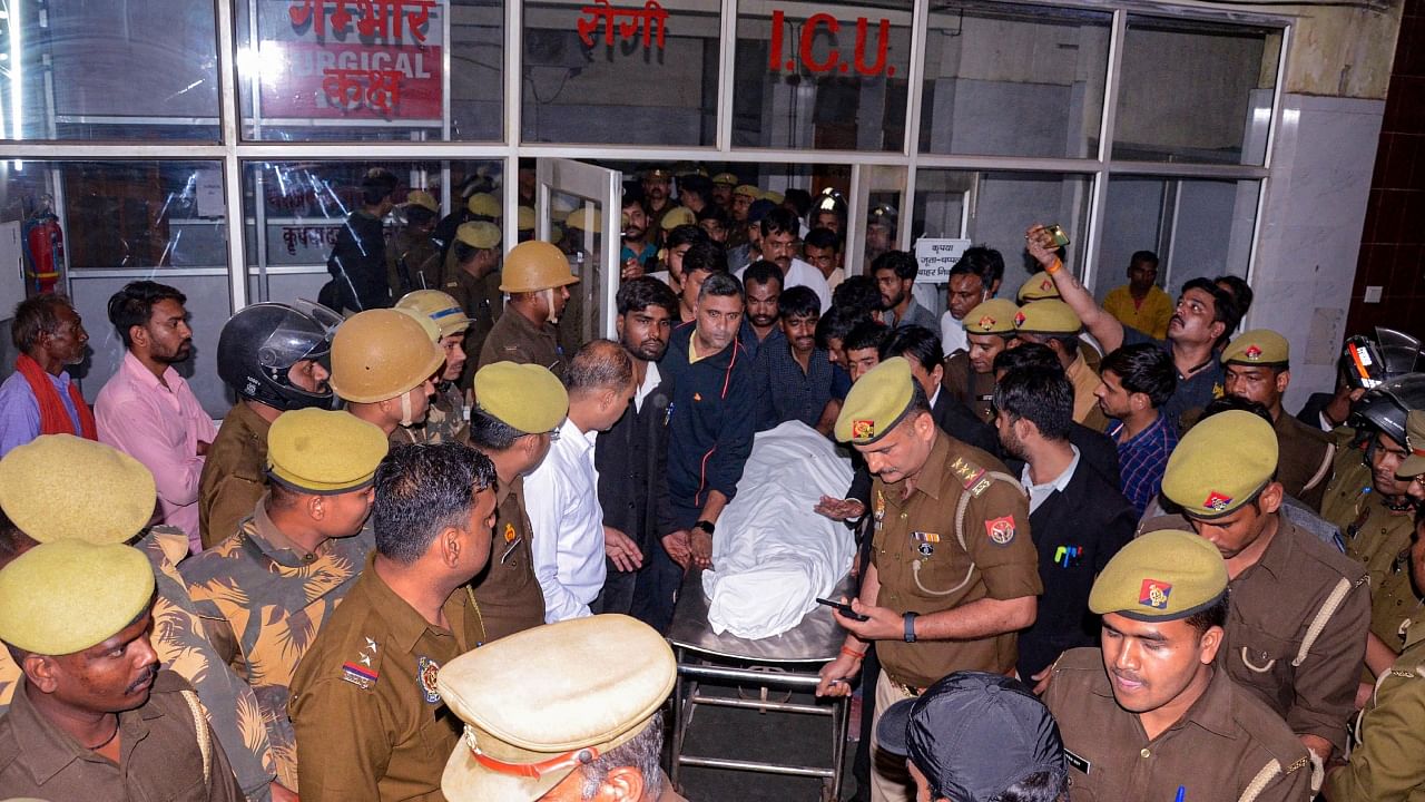  Police personne at SRN hospital after Umesh Pal, key witness in Raju Pal murder case, was shot at his residence, in Prayagraj, Friday, Feb. 24, 2023. Credit: PTI Photo