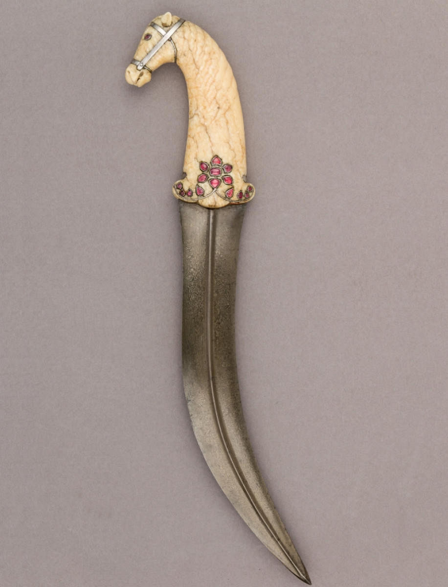 Jambiya (dagger) made of steel, walrus ivory, silver, ruby, and rose quartz. Mughal, 18th century