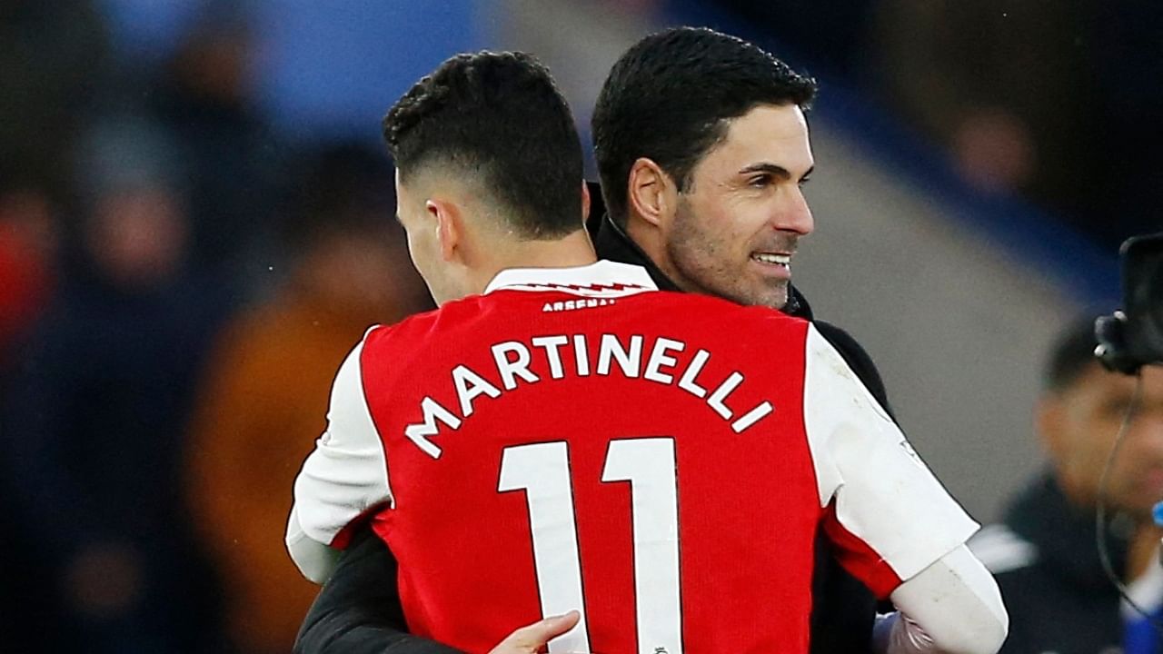 Arsenal manager Mikel Arteta celebrates with Gabriel Martinelli after the match. Credit: Reuters Photo