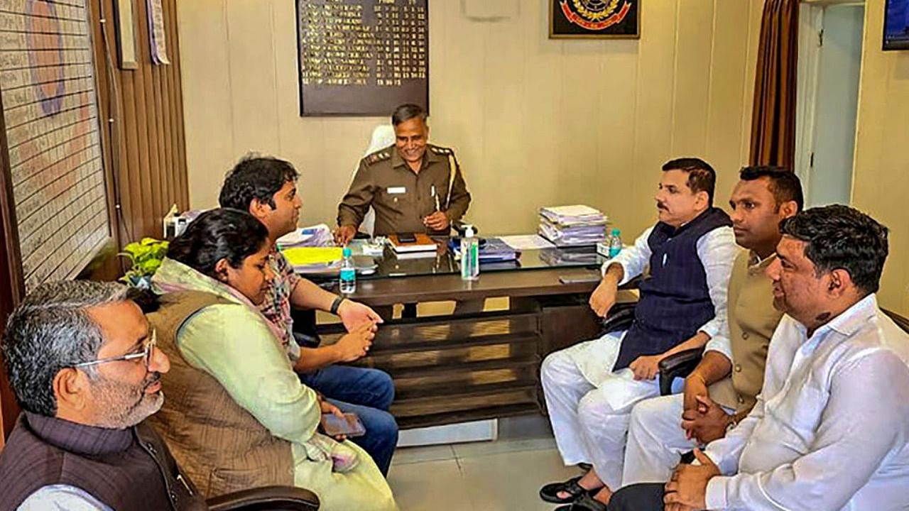 AAP MP Sanjay Singh and others at Fatehpur Beri police station after being detained by police for protesting near CBI office, in New Delhi. Credit: PTI Photo