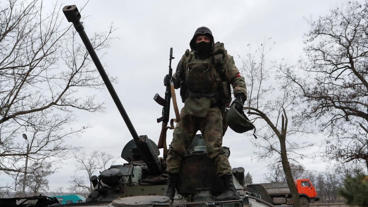 A Russian soldier atop a tank in Ukraine. Credit: Reuters Photo