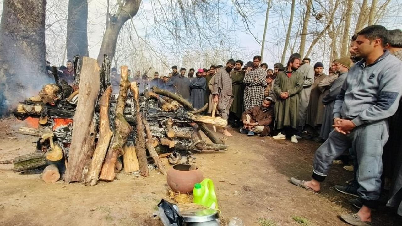 Muslim neighbours perform last rites of Kashmiri Pandit Sanjay Sharma who was killed by a terrorist on Sunday, in Pulwama on Monday, Feb. 27, 2023. Credit: IANS Photo