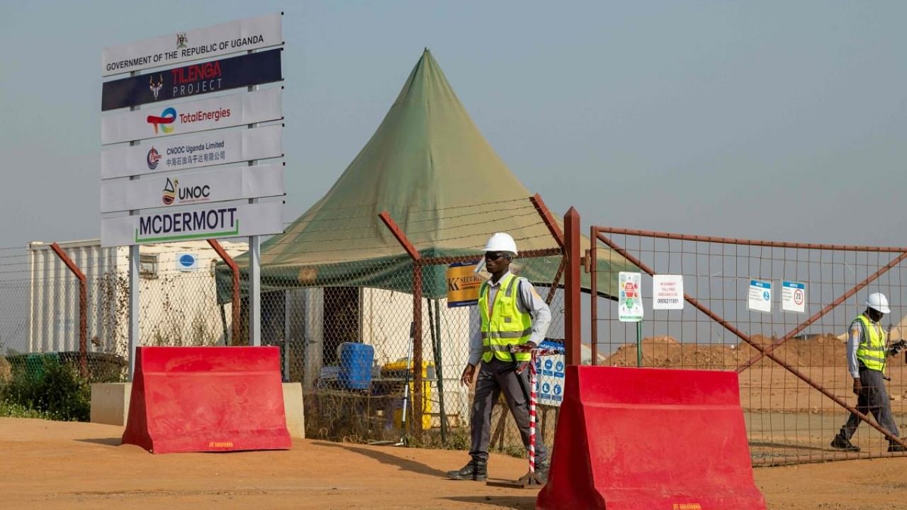 Guards work at TotalEnergies' central processing facility construction in Buliisa, Uganda. Credit: AFP Photo