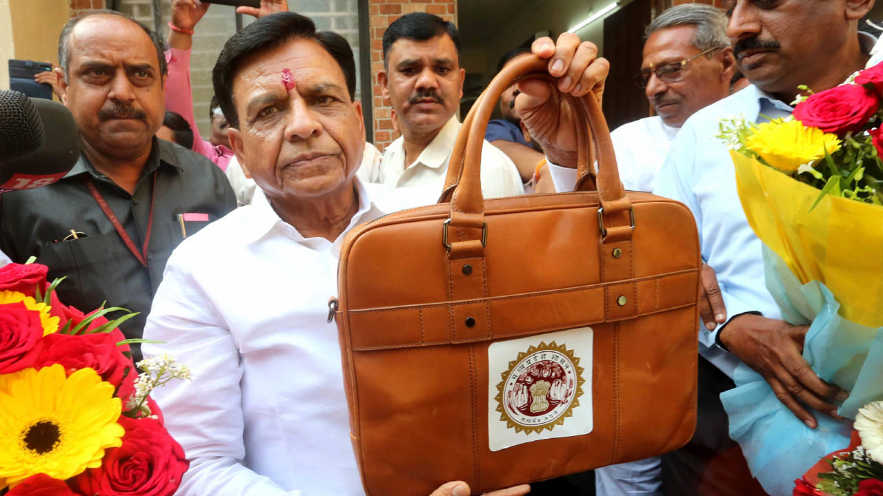 Madhya Pradesh Finance Minister Jagdish Devda leaves to present the State Budget 2023-24 in Assembly. Credit: PTI Photo