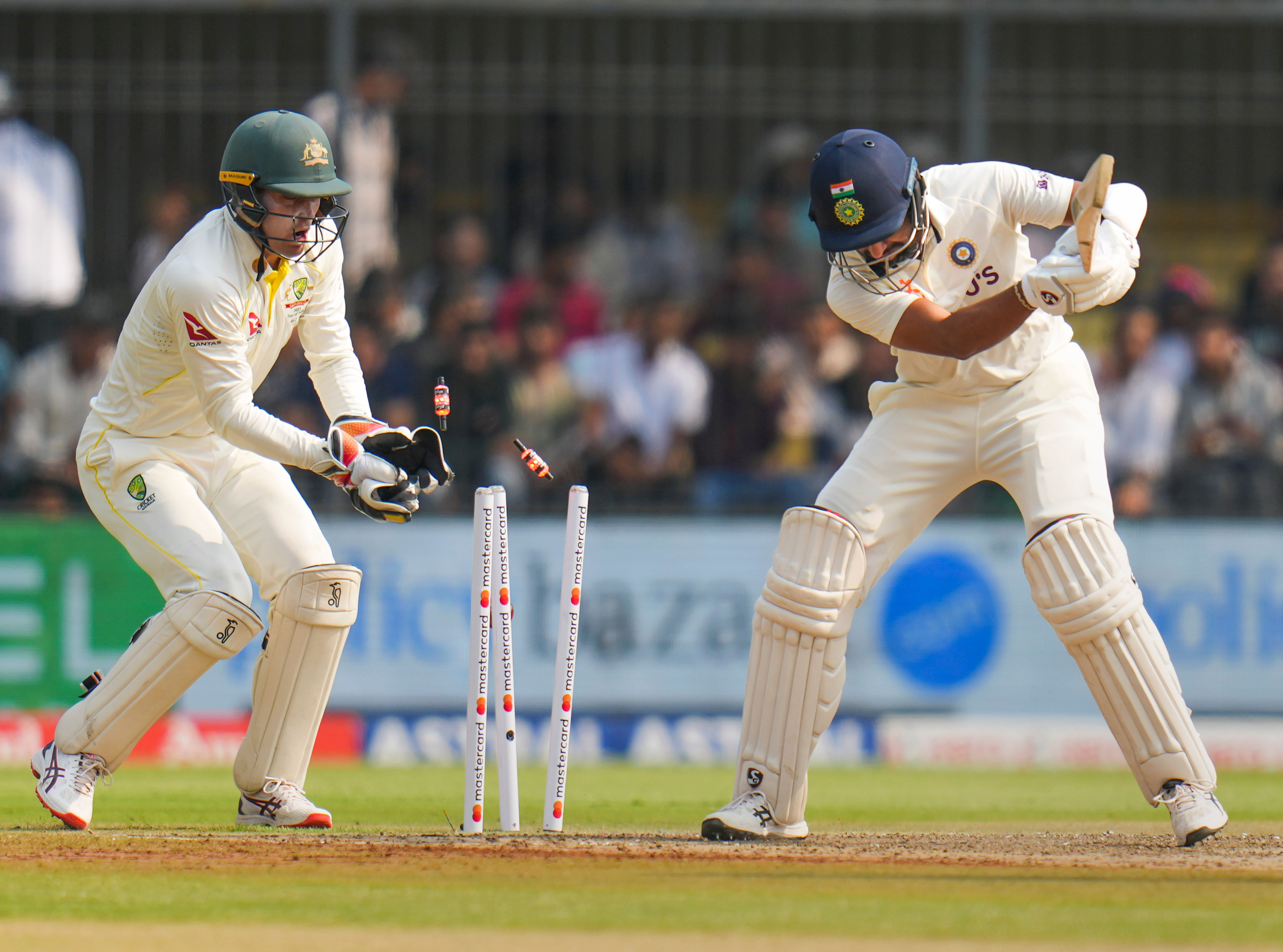 Cheteshwar Pujara is bowled out by Australian spinner Nathan Lyon on Day 1 of the 3rd cricket test match between India and Australia, at Holkar Cricket Stadium in Indore. Credit: PTI Photo