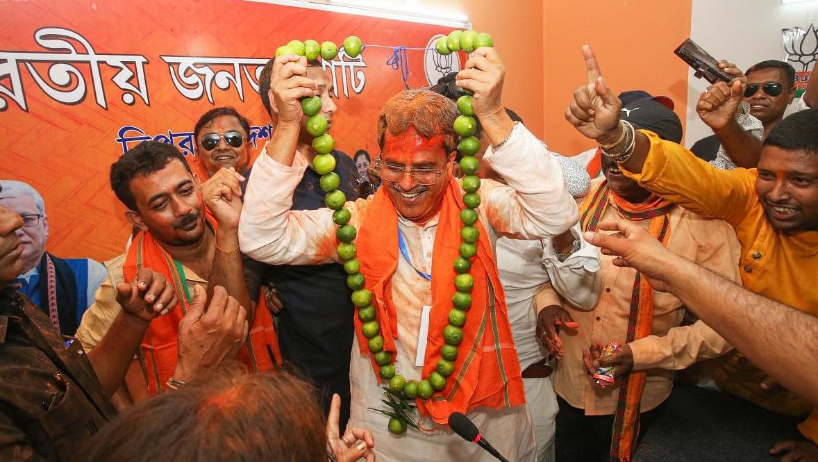 Agartala: Tripura Chief Minister Manik Saha being garlanded by BJP supporters after the party's good performance in the Assembly elections, in Agartala, March 2, 2023. Credit: PTI